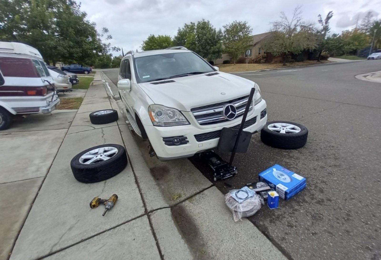 El Paso mobile mechanic mid brake job at a customer curb